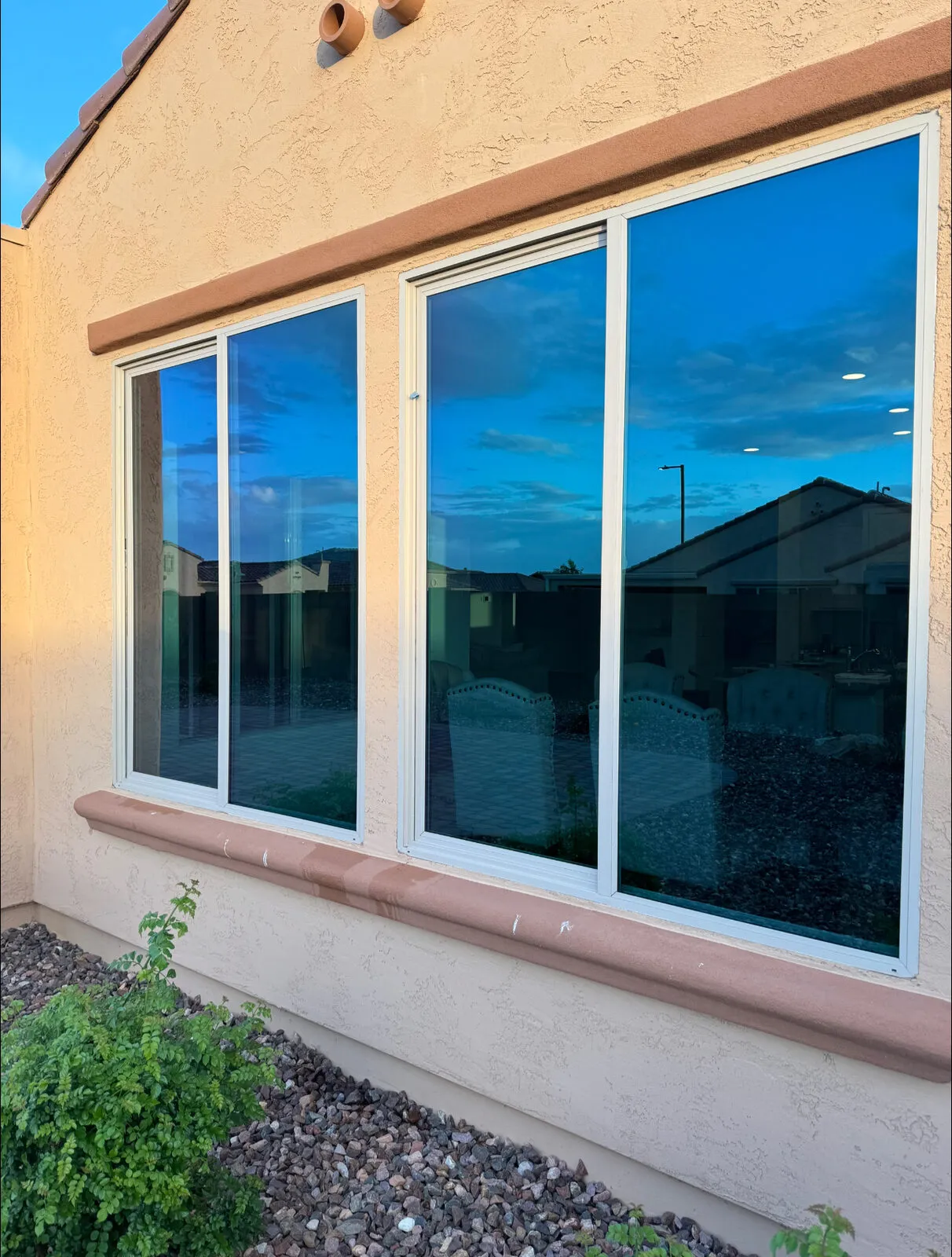 Clear glass reflecting the sunset after a residential window cleaning