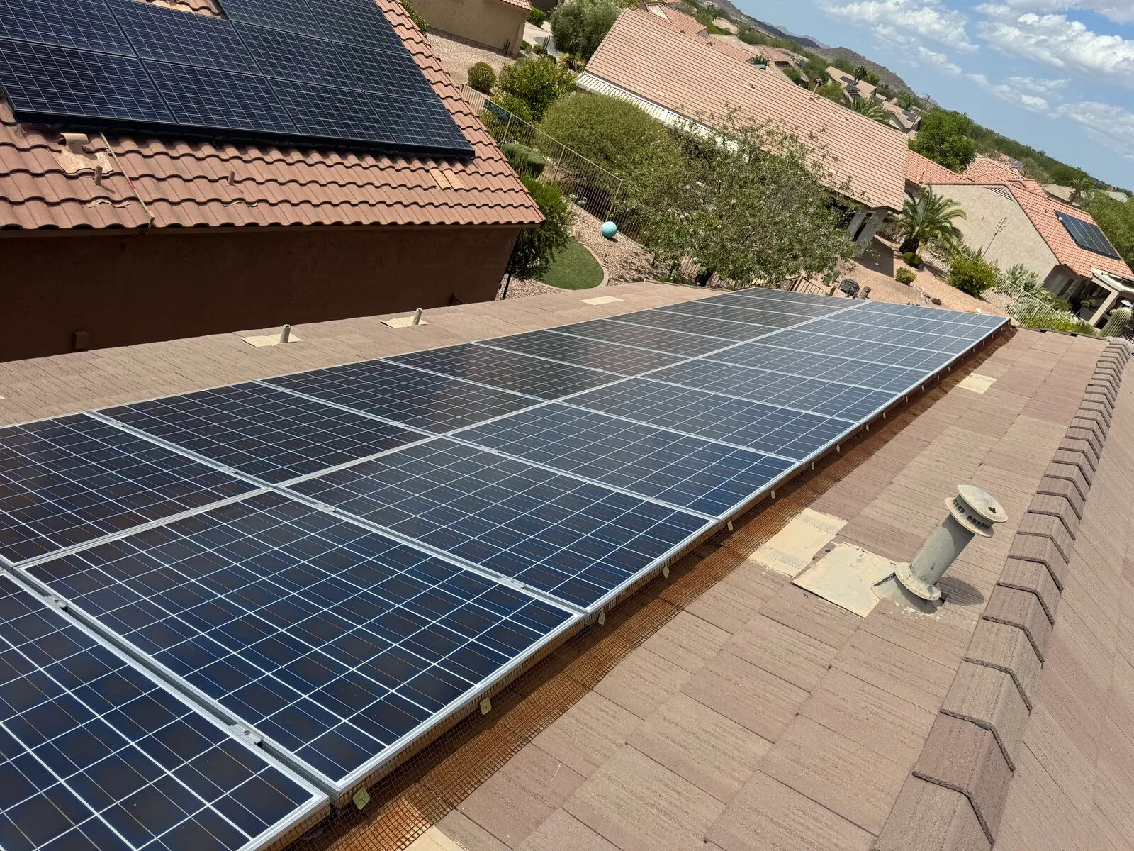 Freshly cleaned rooftop solar array reflecting the sky