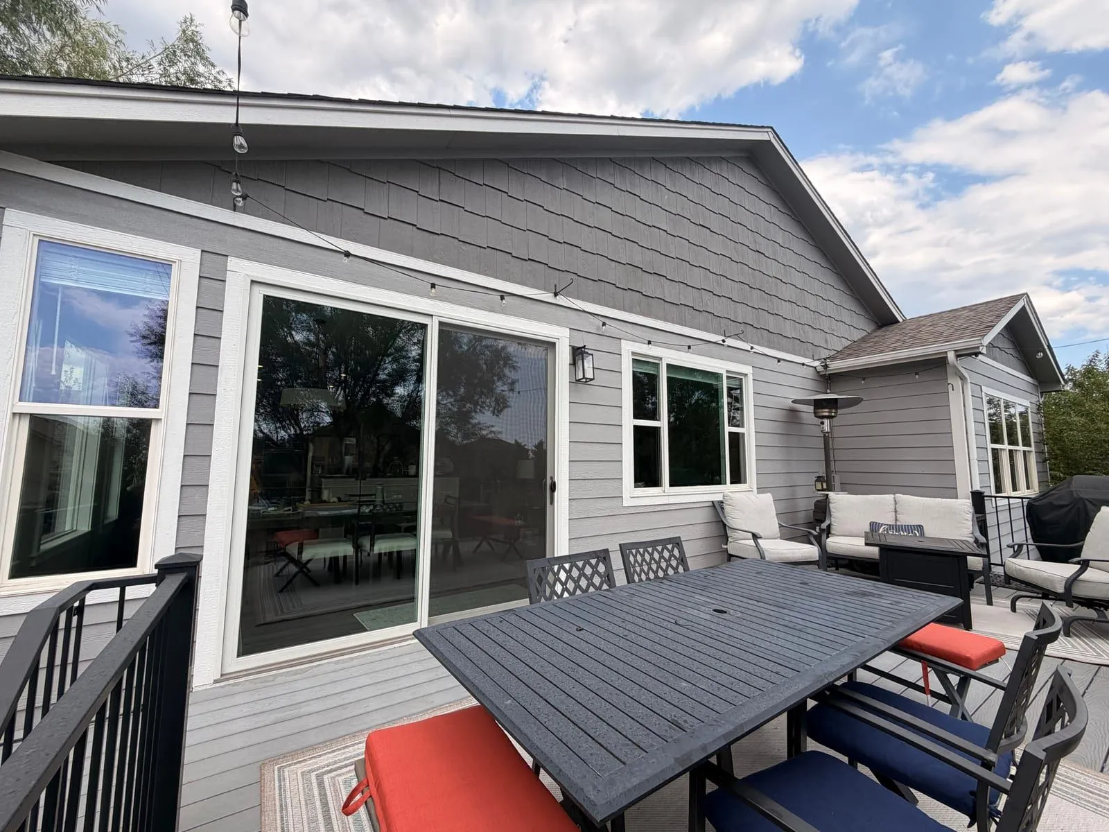 Back deck of a Colorado Springs home with freshly cleaned sliding glass doors and windows